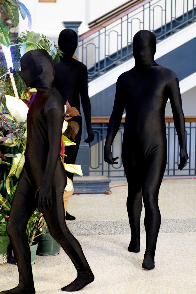 performers in bodysuits