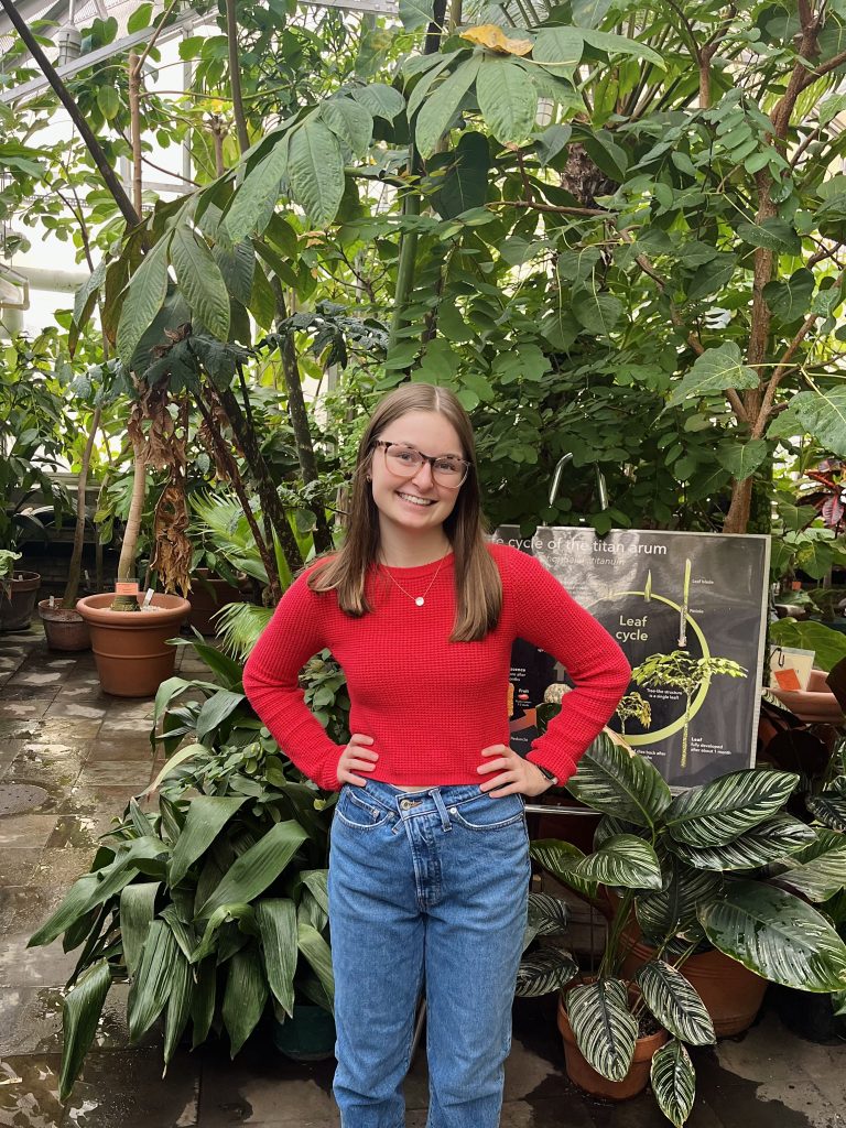 student in greenhouse